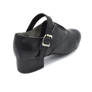 Rear view of black leather jig shoe with block heel and ankle strap