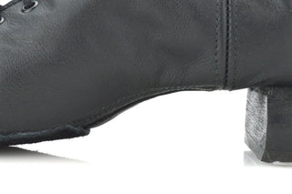 Black leather boys reel dance shoe profile showing curved toe and block heel