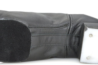 Black leather boys reel shoe side view with reinforced heel and white heel cap